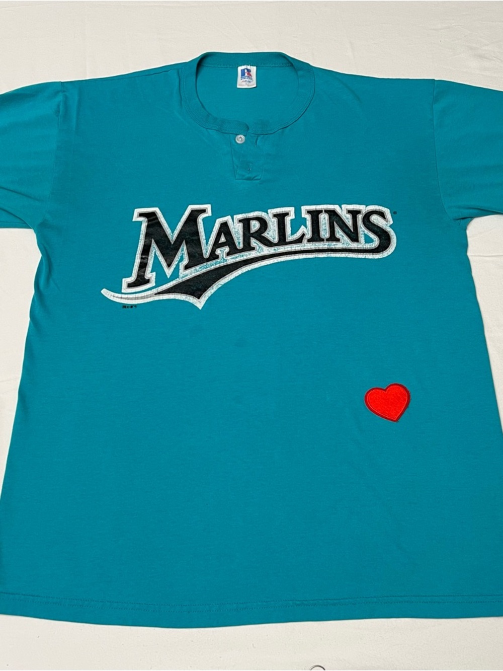Russell Athletic Teal Marlins Short Sleeve Tee with Red Heart Patch